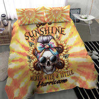 Yellow tie-dye duvet with skull and sunburst graphics, with two matching pillow covers