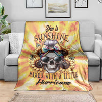 Yellow tie-dye skull-themed blanket with 'She is Sunshine' and 'Hurricane' text, on sofa