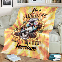 Yellow tie-dye skull art blanket with 'She is Sunshine' headline, draped over couch