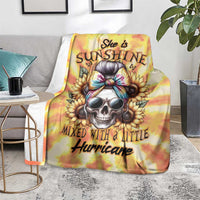 Yellow tie-dye skull print blanket with 'Mixed with a little Hurricane' text, on chair
