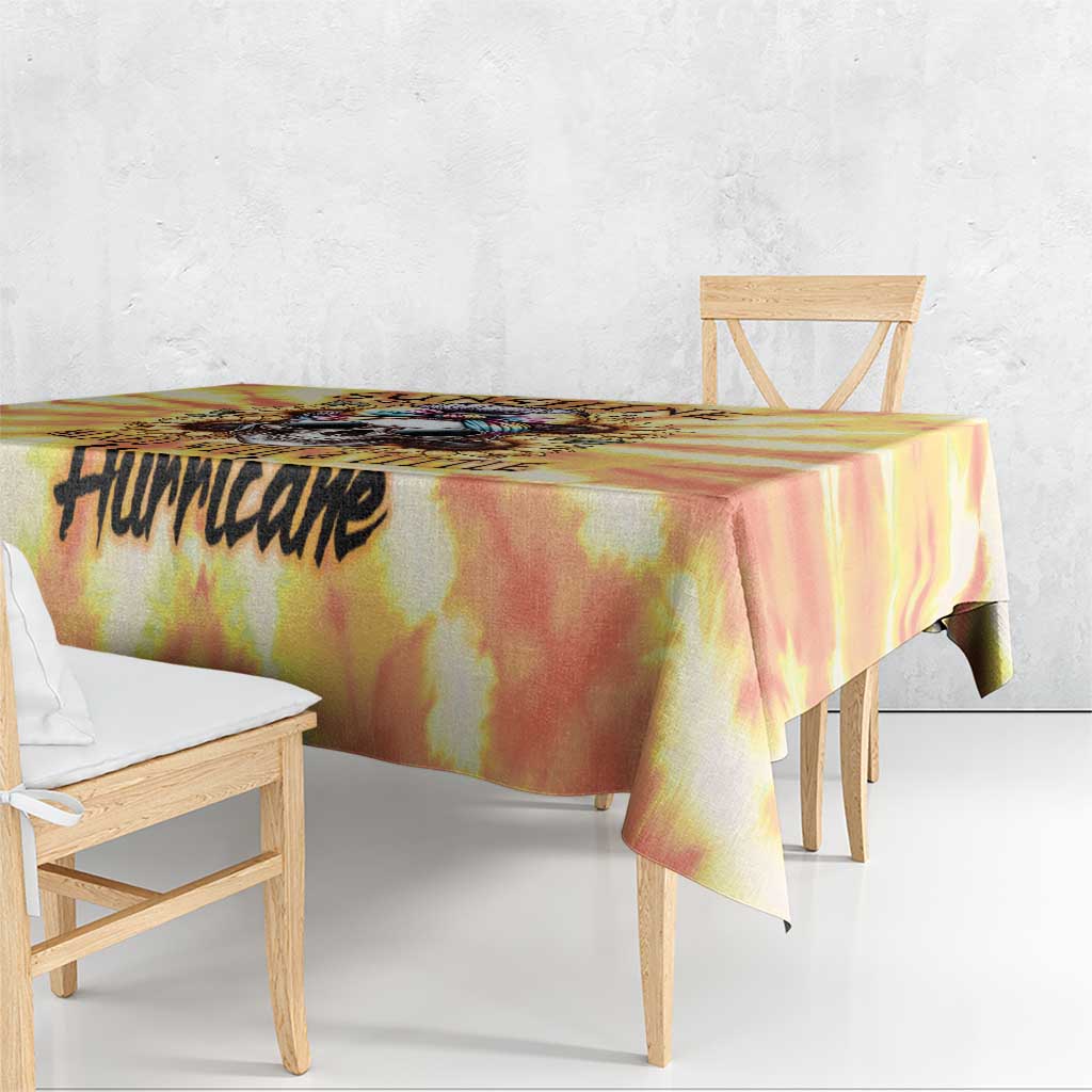 Yellow tie-dye tablecloth with black 'Hurricake' word print along the side
