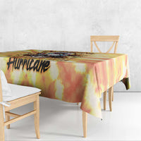 Yellow tie-dye tablecloth with black 'Hurricake' word print along the side