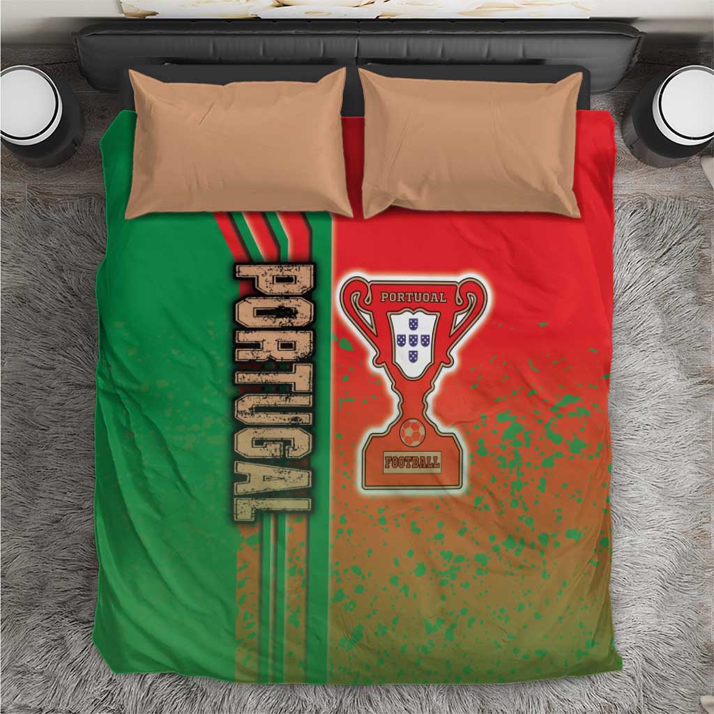 Bedding duvet cover with green/red Portugal logo and crest; two tan pillowcases on bed