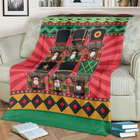 Red and green nutcracker character blanket with decorative border patterns