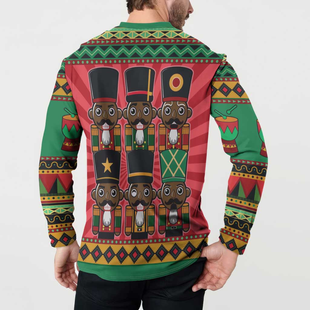 Green nutcracker button sweatshirt worn by model, back graphic panel visible