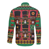 Green long-sleeve button shirt with nutcracker-style Afro graphic back, festive pattern