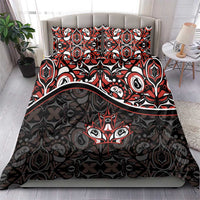 Black duvet set with red and white tribal maple-leaf pattern, two pillows on bed