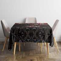 Black rectangular tablecloth with red and white Haida-style maple leaf tattoo pattern