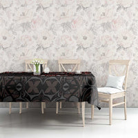 Black tablecloth with red and white Haida maple leaf tattoo design, draped on table