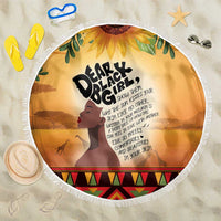 Circular beach blanket, 150cm, yellow-orange print with “Dear Black Girl” text and fringe.