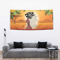 Yellow wall tapestry with woman profile, pride text, sunflowers overhead, and patterned border