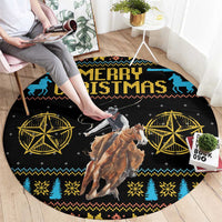 Round Christmas rug on floor, black “Merry Christmas” text with cowboy and reindeer center.