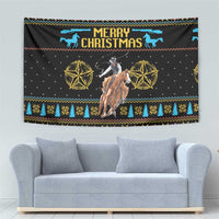 Christmas tapestry with cowboy on horse, blue “Merry Christmas” lettering, and decorative trim