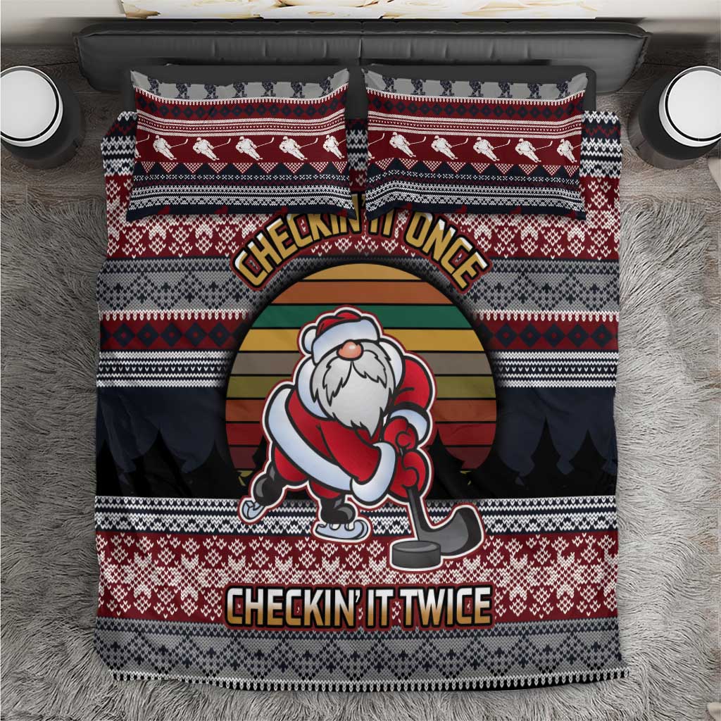 Bedding set with red and dark striped hockey Santa graphic, “Checkin’ It Once” and “Twice”