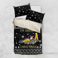 Black bedding set with two pillow shams and duvet; yellow tractor, snowflakes, 'I'm Digging'