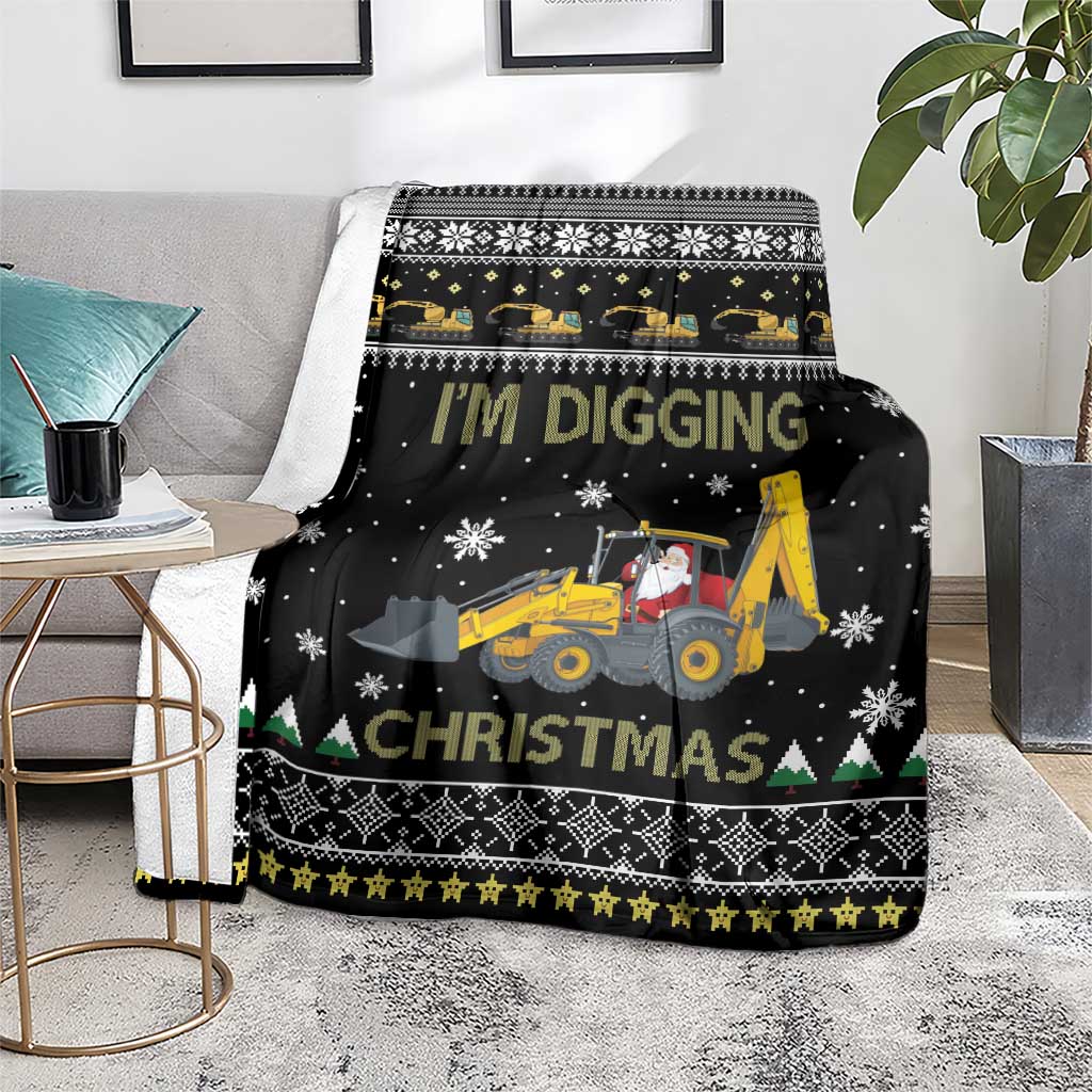 Black Christmas blanket with tractor scene, snowflake accents, and green triangle evergreen trim