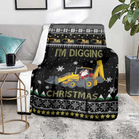 Black Christmas blanket with tractor scene, snowflake accents, and green triangle evergreen trim