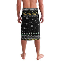 Black Christmas shorts with festive border print, snowflakes, and small tractor motifs