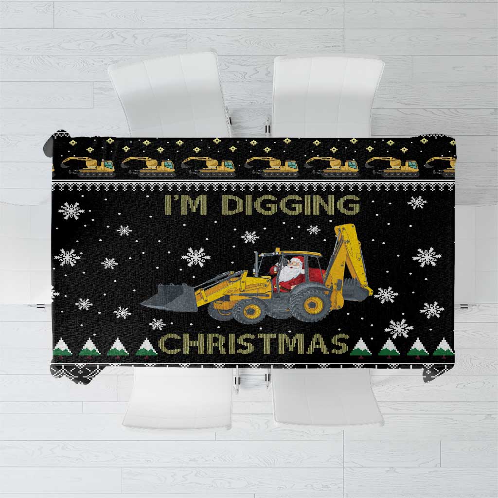 Black tablecloth with 'I'M DIGGING' text, yellow tractor, and snowflake border