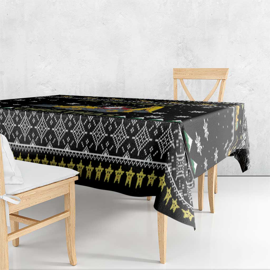 Black tablecloth draped over bench with tractor and snowflake pattern