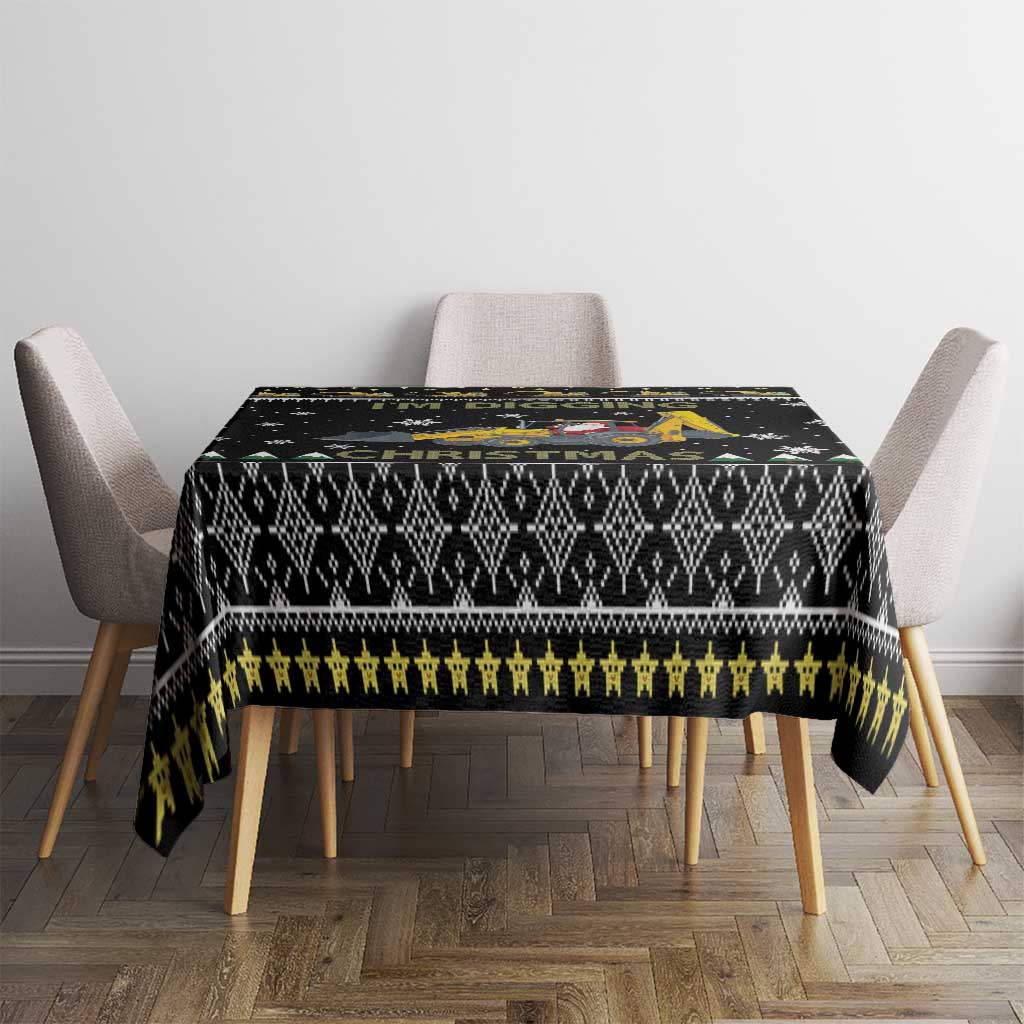Black Christmas tablecloth with geometric motifs, yellow stripe, and green accents