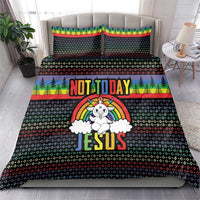Christmas bedding set on bed: black duvet with rainbow stripe, trees, unicorn JESUS graphic, 2 pillows