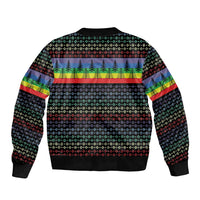 Unisex black bomber jacket with multicolor holiday knit pattern on back and ribbed cuffs