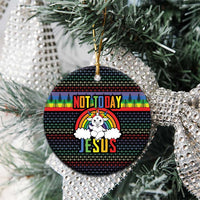 Round ceramic Christmas ornament hanging on a tree, rainbow “NOT TODAY” and “JESUS” design