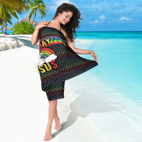 Black sarong with rainbow “Not Today Jesus” graphic, worn by woman on beach.