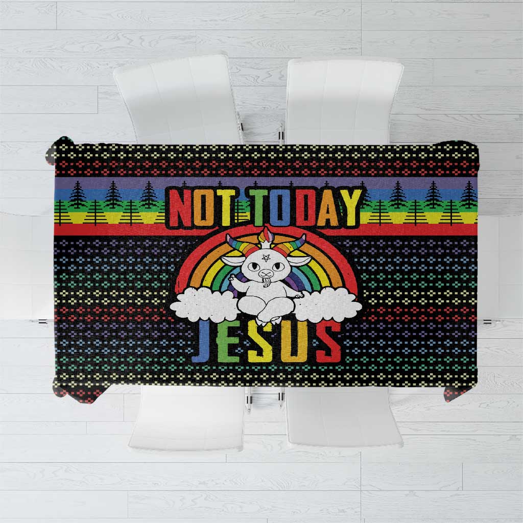 Black tablecloth with rainbow Christmas design and large “Not Today Jesus” print.
