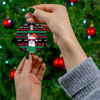 Round llama ceramic ornament with red-and-green festive pattern and green scarf, gold loop.