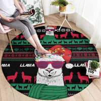 Round black llama Christmas rug, festive llama face in center with red, green animal silhouettes