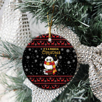 Black owl ceramic Christmas ornament, round, on tree branch with red Nordic trim