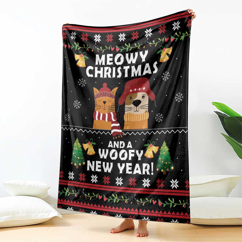 Black holiday blanket draped with cat and dog graphic, winter icons and red trim
