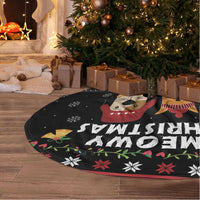 Black round tree skirt with white fringe, oversized cat-and-dog holiday print detail.