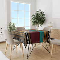 Pug-themed tablecloth with multicolor stripes, dog-and-bones graphic over dining table