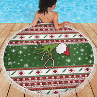 Round green Christmas beach blanket with nurse stethoscope graphic and white tassel fringe