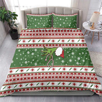 Green holiday quilt set with two matching pillowcases; snowflakes, red cross icons, stripes
