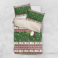 Green holiday duvet set with matching pillowcases; snowflakes and red cross icon stripes