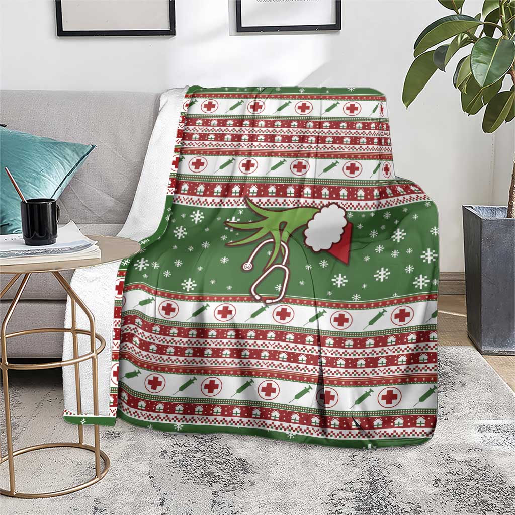 Green Christmas blanket on floor, red-and-white cross stripes with snowflakes and stethoscope graphic.