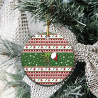 Round ceramic nurse-themed Christmas ornament, green with festive red patterns and hanging loop
