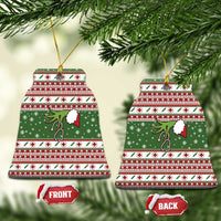 Green ceramic nurse Christmas bell ornament with red-and-white stripes, stethoscope and nurse cap