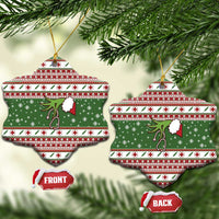 Two star-shaped green ceramic nurse Christmas ornaments with red-and-white stripes and stethoscope