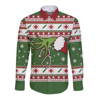 Green long-sleeve button shirt with Christmas medical print, front view