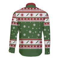 Green long-sleeve button shirt with Christmas medical print, back view