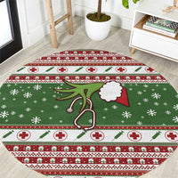 Round Christmas rug with green base, red and white plus signs and festive accents