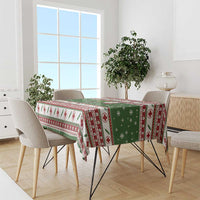 Green Christmas tablecloth with medical-cross print and red patterned border