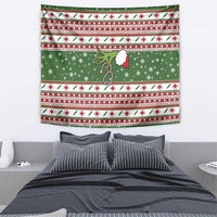 Green Christmas nurse-themed tapestry hanging above a bed with red-and-white patterned trim