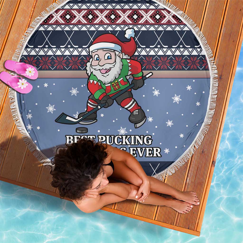 Round blue beach blanket with white fringe, Santa hockey in winter sweater pattern