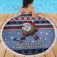 Blue round fringe beach blanket featuring a Santa hockey player and snowy icons